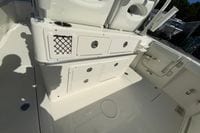 2026 Cobia 265 Center Console boat interior with storage compartments and seating.