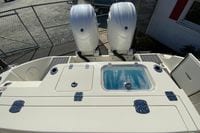 2026 Cobia 265 Center Console boat with dual engines and livewell.