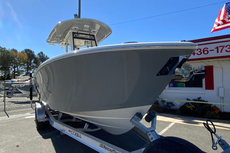 2026 Cobia 265 Center Console boat on trailer, displayed outdoors.