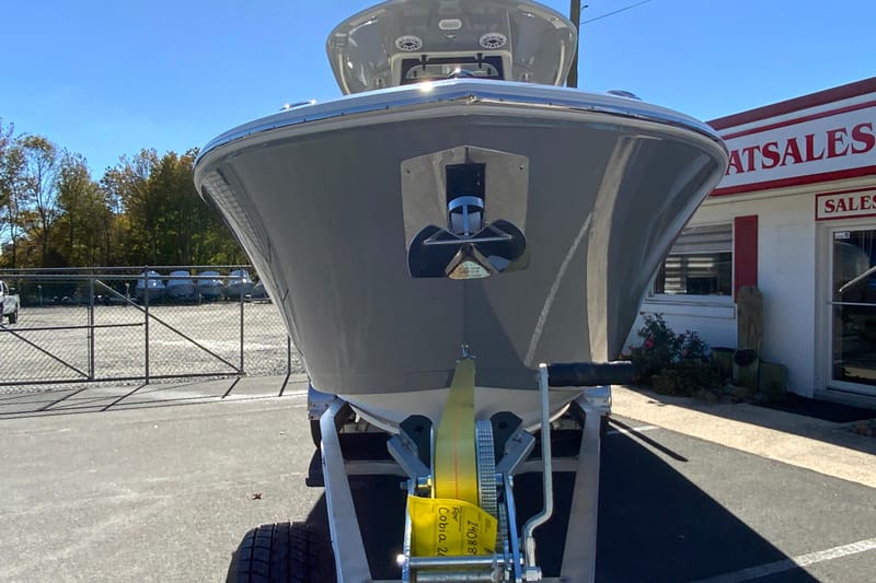2026 Cobia 265 Center Console boat on trailer at dealership.