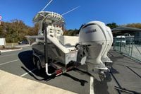 2026 Cobia 265 Center Console boat with dual Yamaha engines on a trailer.