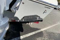 2026 Cobia 265 Center Console boat with Seakeeper stabilizer on trailer.