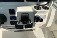 2019 Cobia 262 Center Console boat dashboard with Yamaha controls and cup holders.