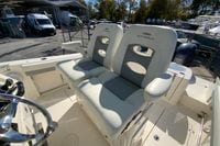 2019 Cobia 262 Center Console boat with dual cushioned seats and steering wheel.