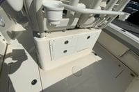2019 Cobia 262 Center Console boat interior with storage compartments and cup holder.