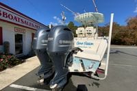 2019 Cobia 262 Center Console boat with twin Yamaha 150 engines at dealership.