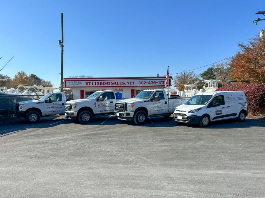 The RT 113 fleet of trucks and the service van outside the shop in Selbyville, Delaware
